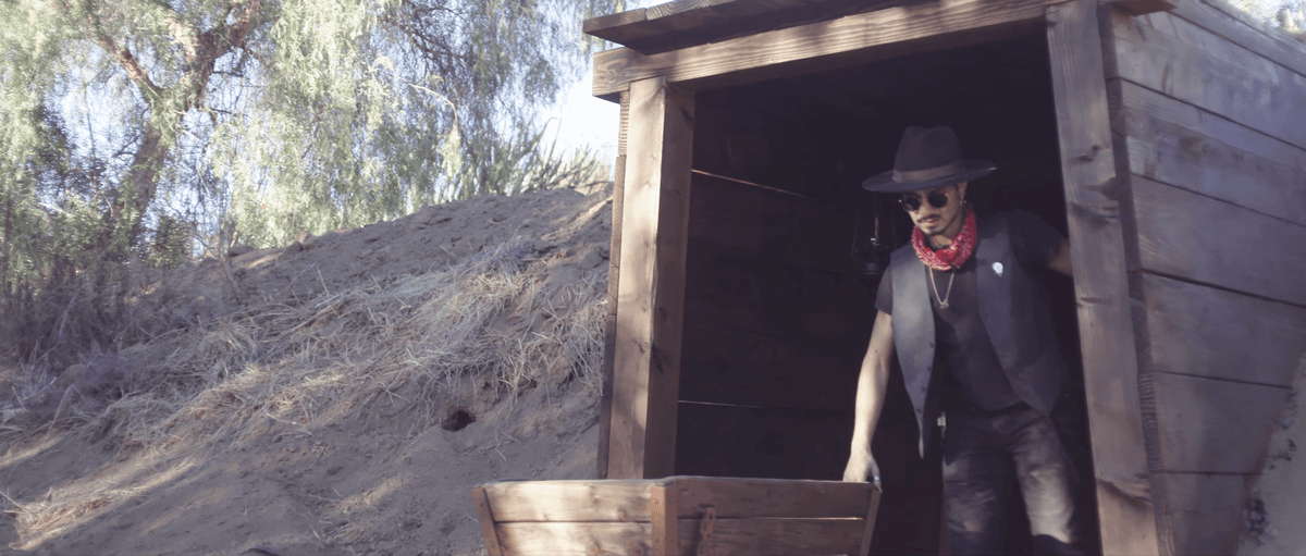 Outlaw at the gold mine shaft entrance